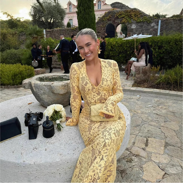 Elegant yellow V-neck lace maxi dress for women, featuring voluminous sleeves & tailored fit. Perfect for special occasions.