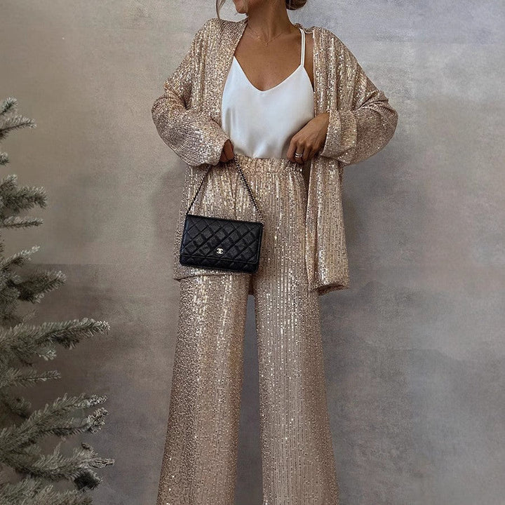 Women's glittering sequin blazer suit with wide leg pants, perfect for evening wear.