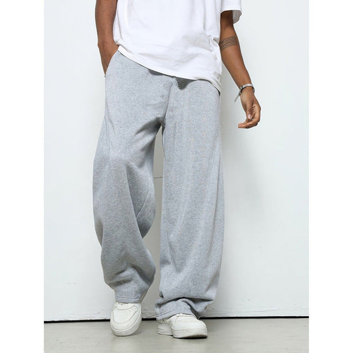 Relaxed fit men's jogging pants, offering freedom of movement for sports, lounging, & active days.