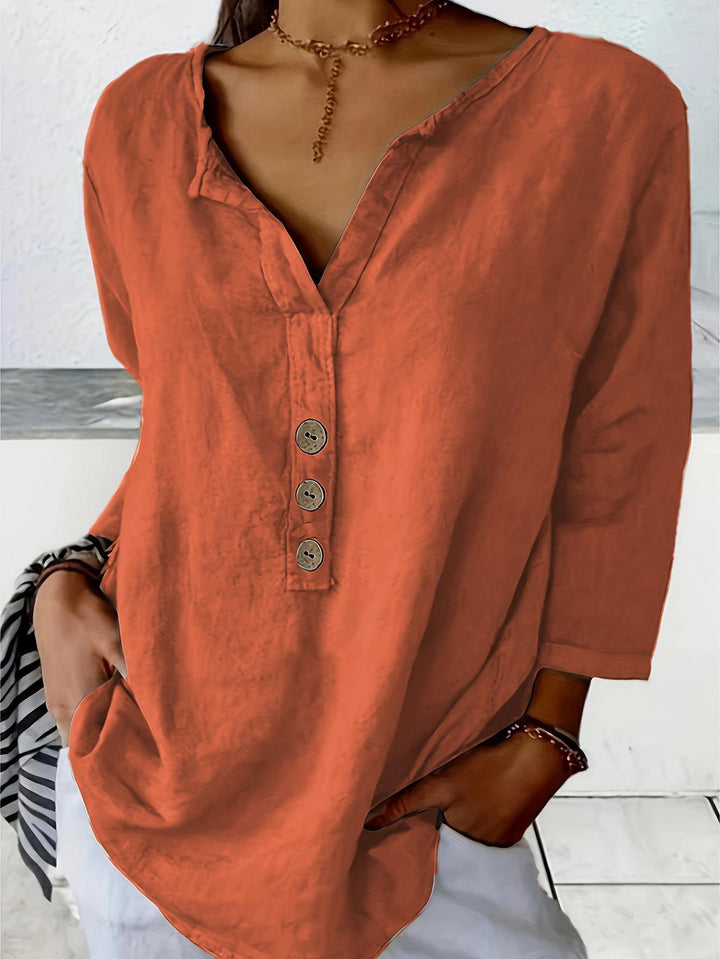 Everyday comfortable women's v-neck button-down blouse. Loose fit, 3/4 sleeve casual top for relaxed fashion.