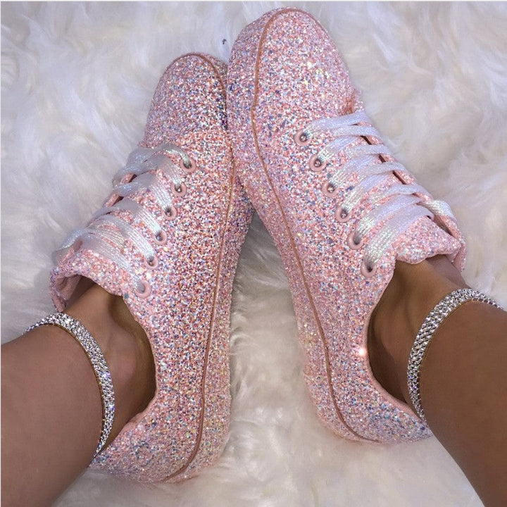Close-up of the breathable sole on women's sparkling comfort sneakers, ensuring everyday comfort & stylish support.