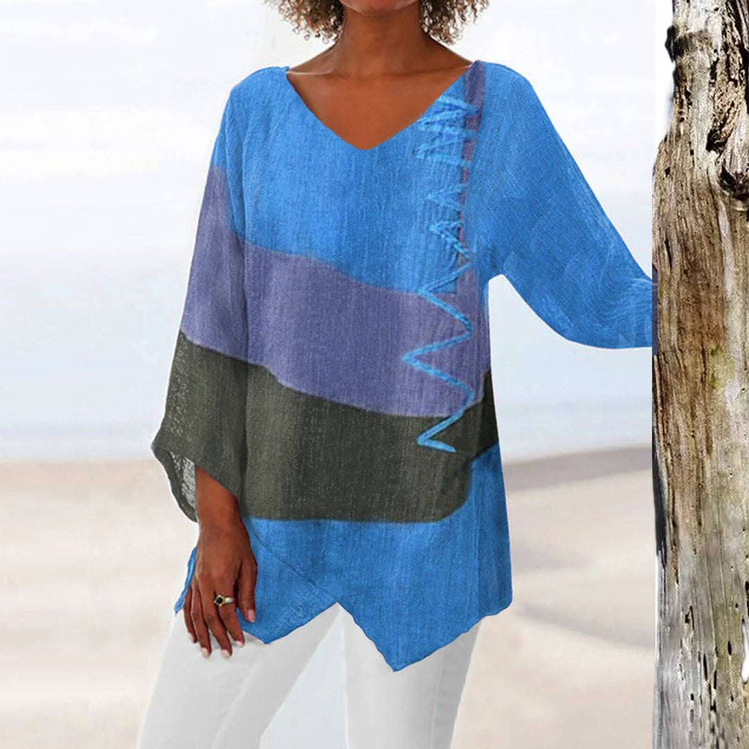 Comfortable ladies' patterned summer blouse, a stylish geometric short-sleeve top for spring fashion or vacation.