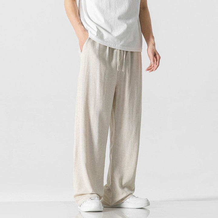 Men's loose fit casual trousers with comfortable drawstring waist, perfect for everyday wear.