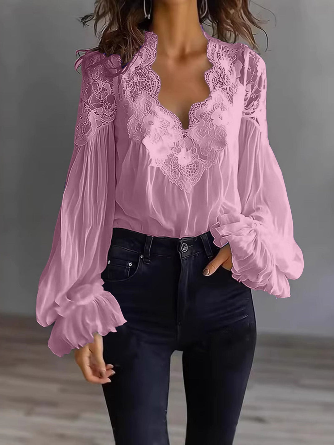 Women's casual yet elegant lace top with flowing lines and pretty ruffle long sleeve details.