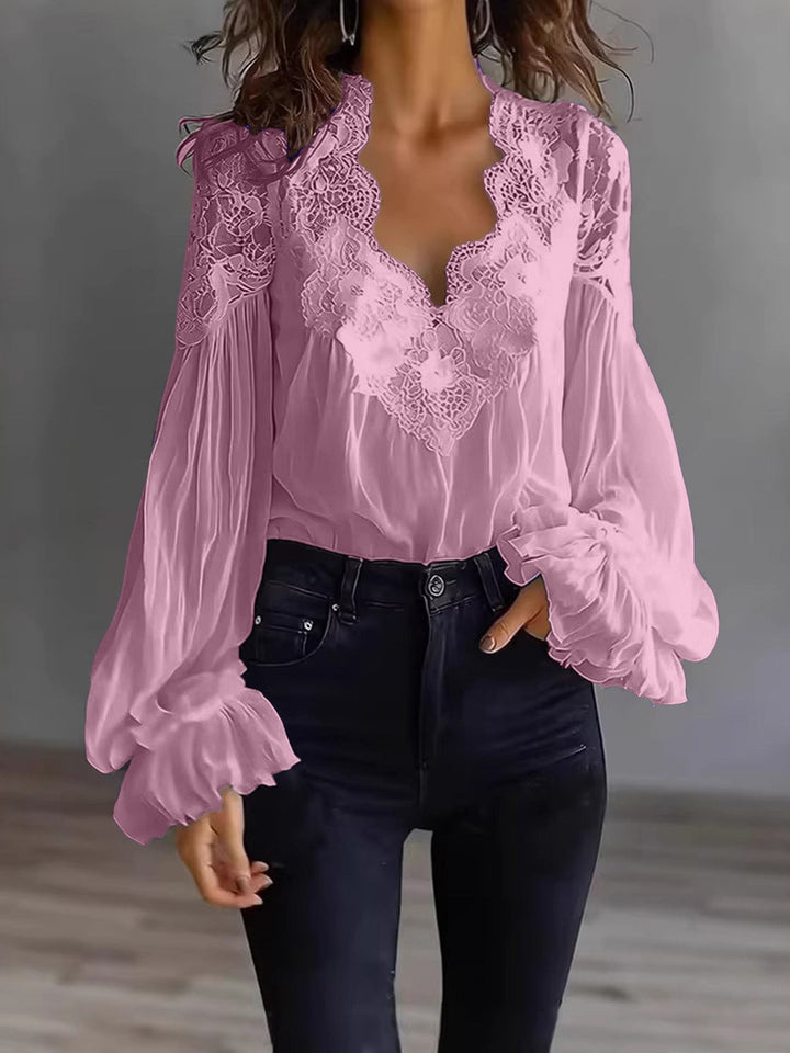 Women's casual yet elegant lace top with flowing lines and pretty ruffle long sleeve details.