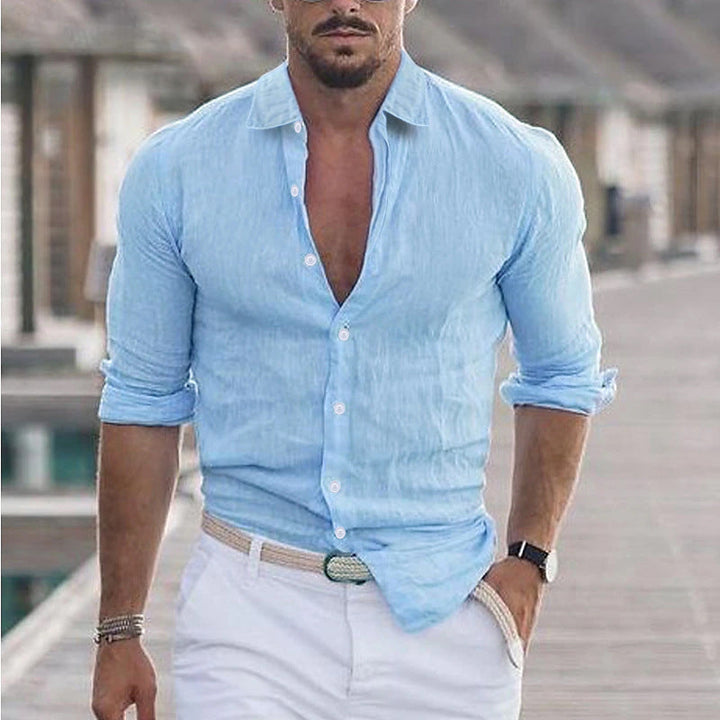 Side view of a man confidently wearing a stylish collared lightweight shirt for summer.