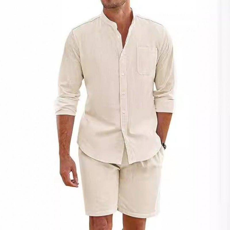 Relaxed fit men's two-piece outfit: short sleeve shirt with stand-up collar & comfy shorts. Summer fashion.