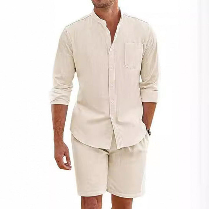 Relaxed fit men's two-piece outfit: short sleeve shirt with stand-up collar & comfy shorts. Summer fashion.