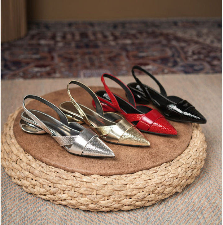 Sleek silver slingback heels for women, metallic pointed toe, stiletto heel, stylish and formal footwear.