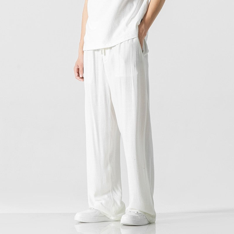 Comfortable men's loose fit summer pants with drawstring waist, ideal for casual everyday wear.