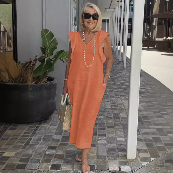 Black elegant sleeveless women's dress, a chic V-neck maxi perfect for summer evenings or vacation.
