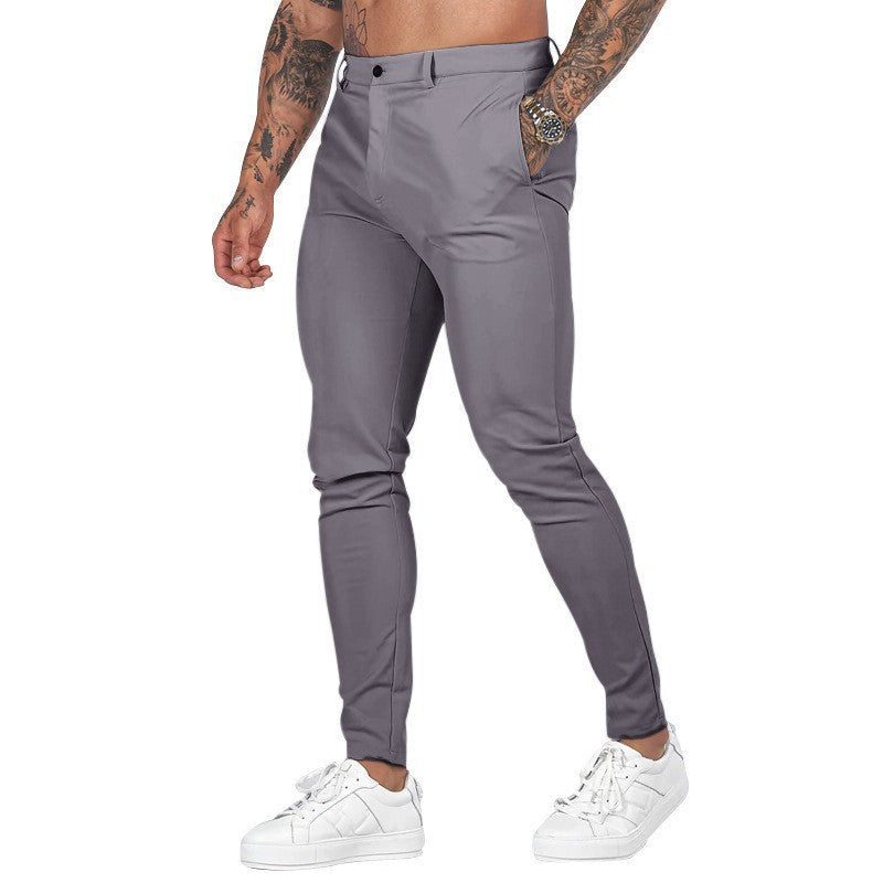 Men's slim-fit stretch chinos paired with a polo shirt, creating a classic & comfortable summer outfit.