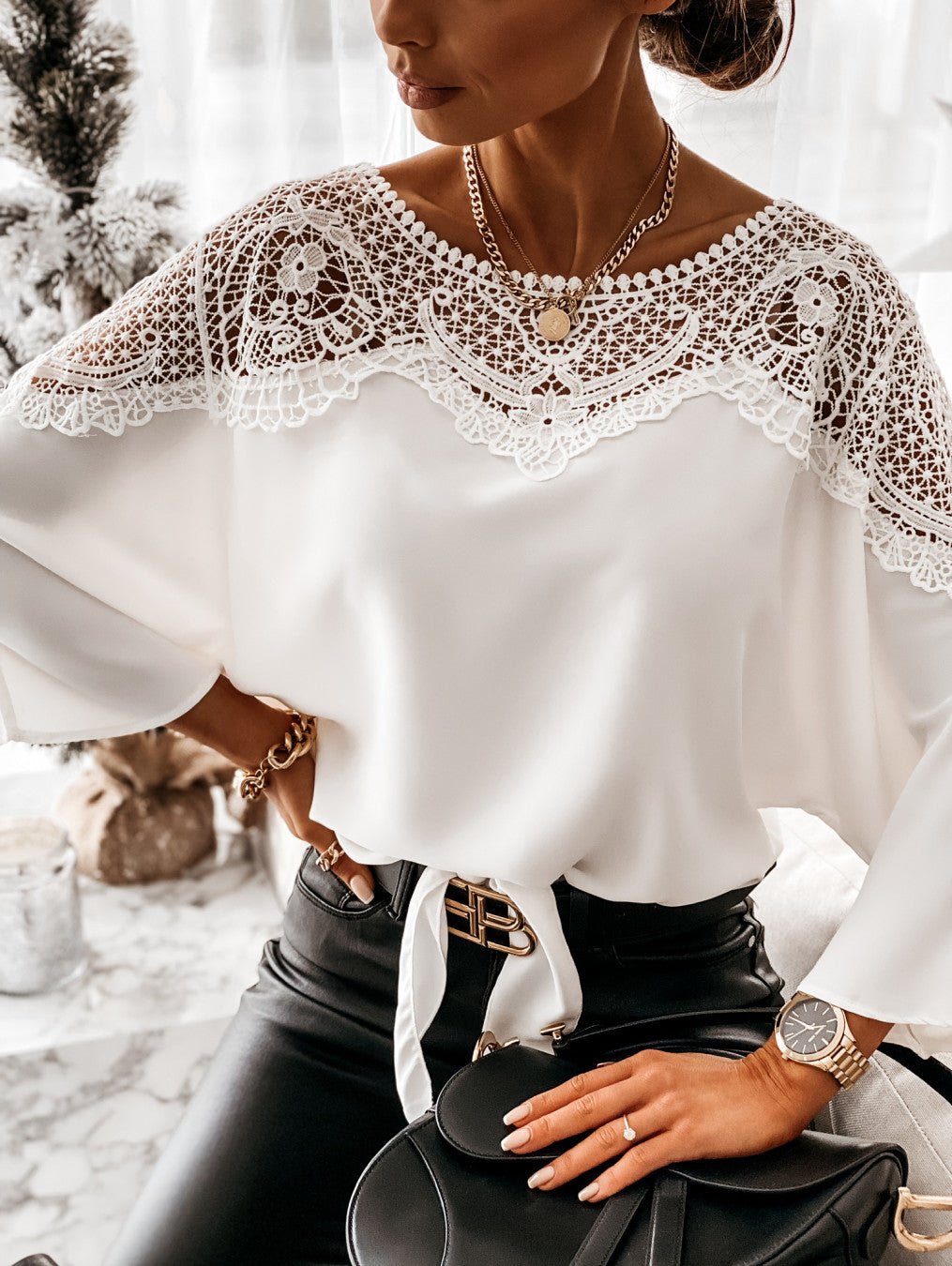 Fashionable lace detail blouse for women, offering a graceful and elegant silhouette.