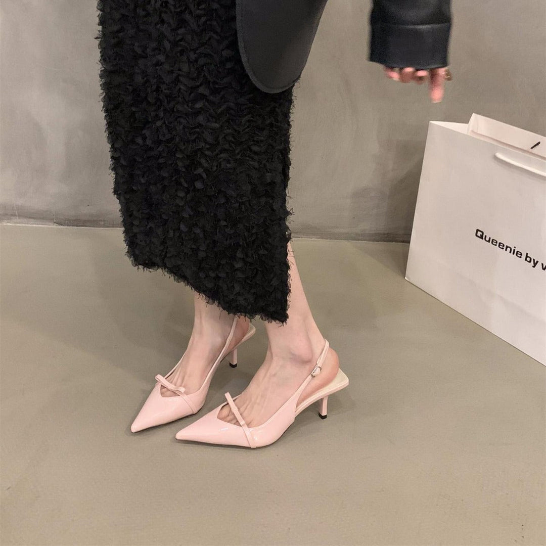 Stylish women's slingback heels, delicate strap design, pointed toe, perfect party or evening footwear.