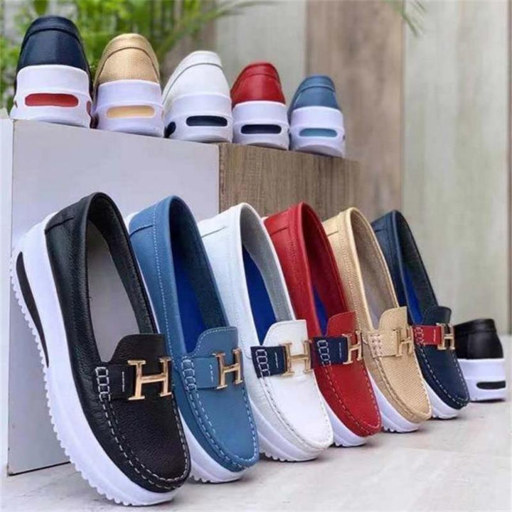 Women's comfortable slip-on loafers with a stylish wedge heel, perfect for everyday walking.