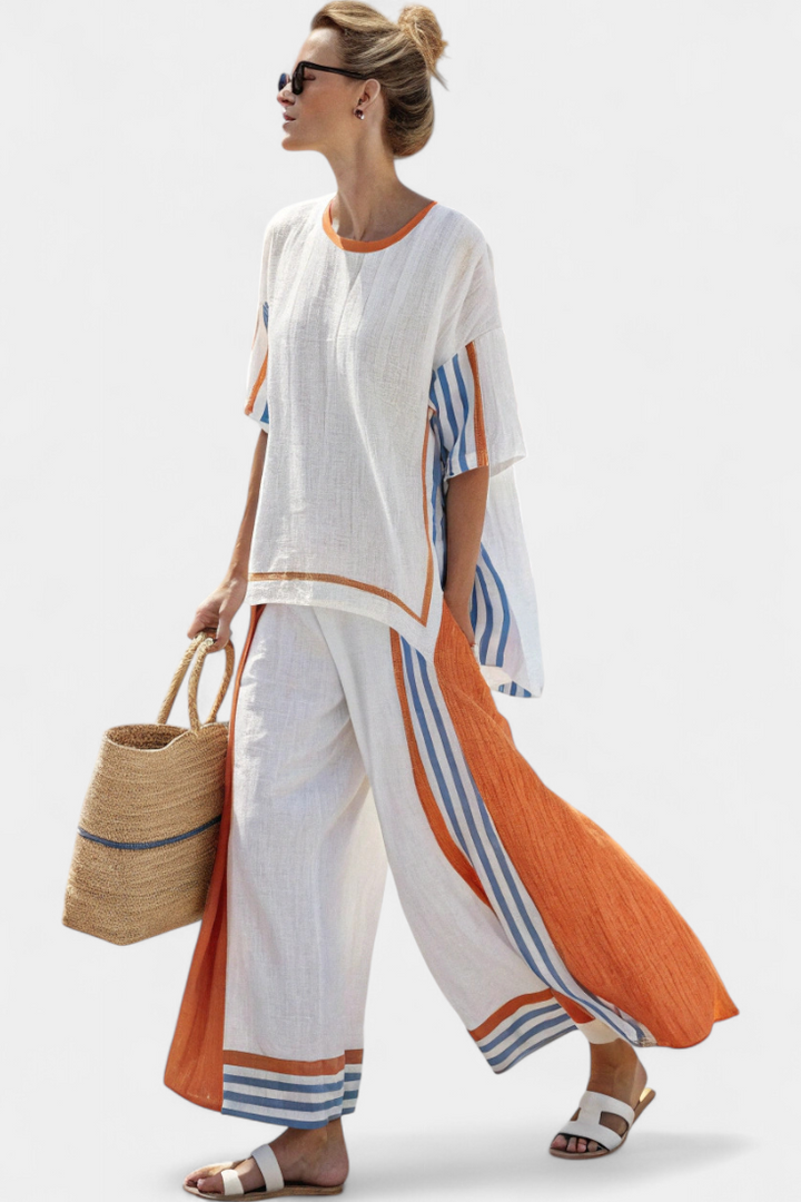 Chic women's matching striped two-piece set with wide-leg pants and short-sleeve top for summer.