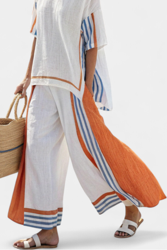 Matching women's striped short-sleeve top and wide-leg pants set, comfortable for warm weather.