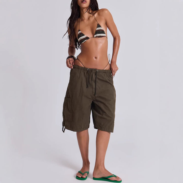 Stylish women's utility cargo shorts featuring an adjustable waist for a custom, comfortable fit. Ideal for summer.