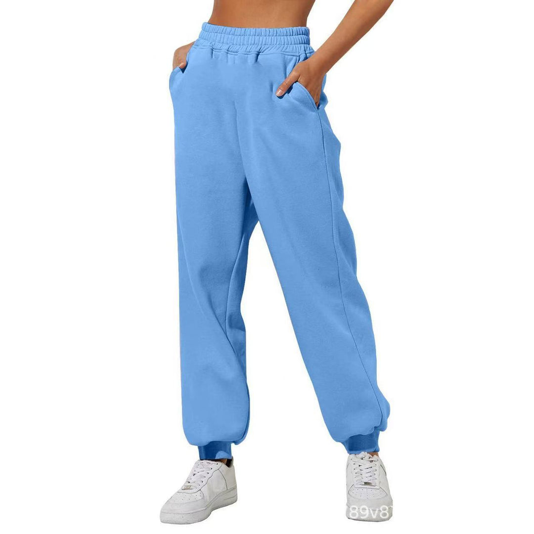 Relaxed fit women's lounge wear pants, elastic waist & pockets, ideal for unwinding after a long day.