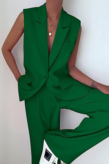 Stylish women's summer business suit: sleeveless blazer and flowy wide leg pants. Coordinated fashion.