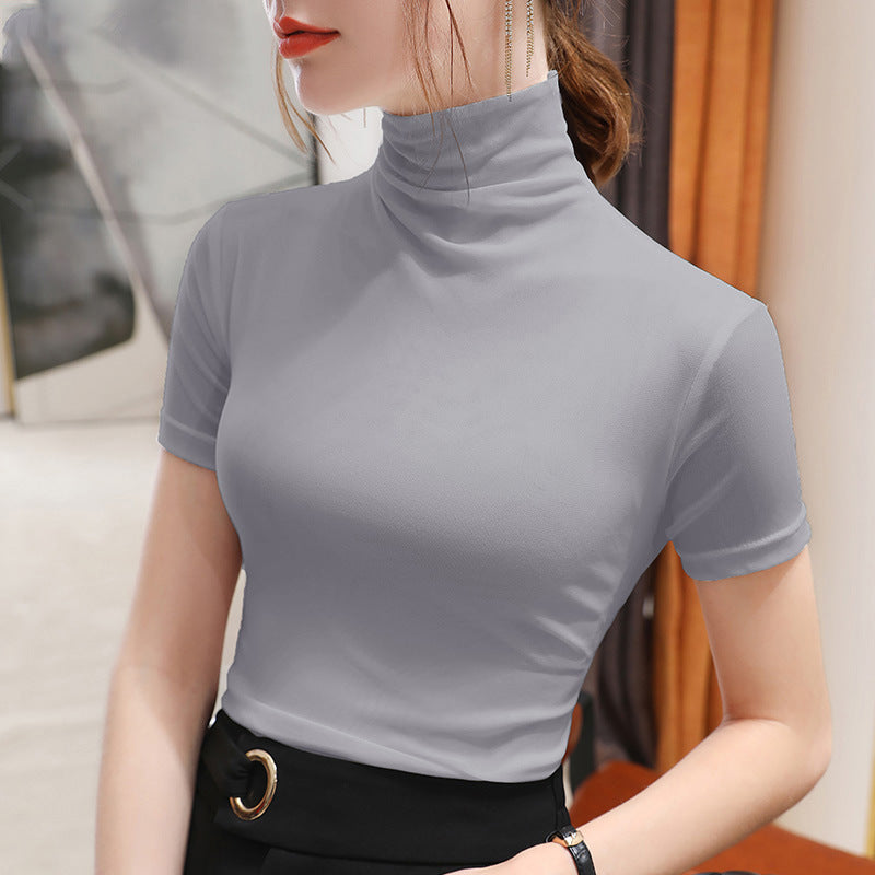 Model wearing: Chic short sleeve turtleneck, showcasing elegant figure-hugging fit.