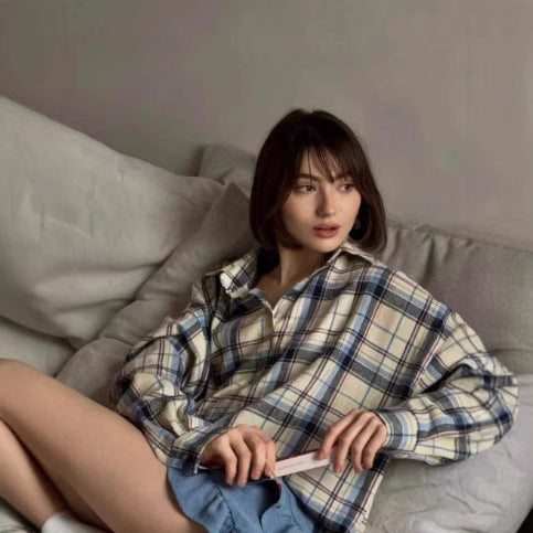 Relaxed fit women's plaid long-sleeve button-up shirt, oversized style, perfect for laid-back fashion.