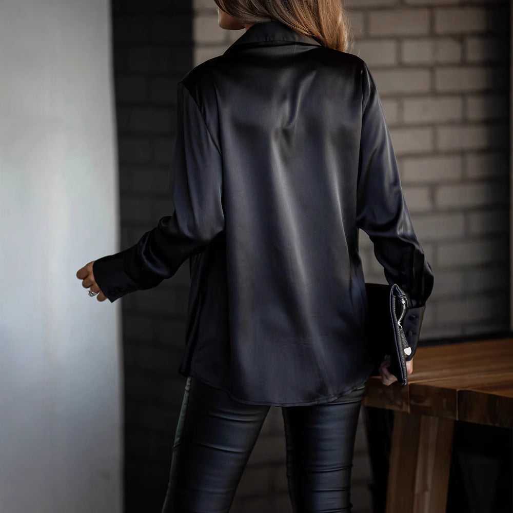 Elegant women's black deep V-neck blouse with dropped sleeves. Loose fit top for chic, versatile everyday style.