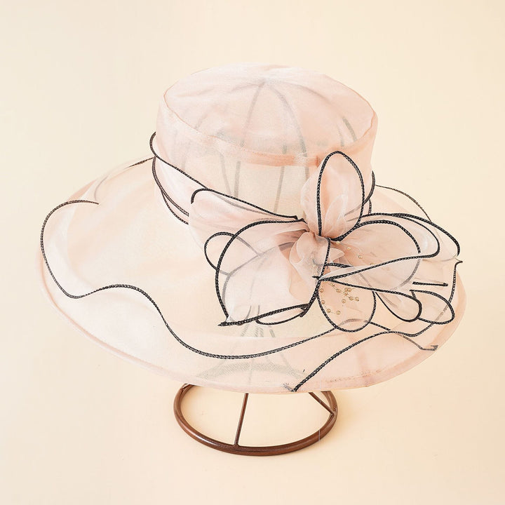 Classic elegant mesh sun hat for women, adorned with a romantic bow, perfect for summer.