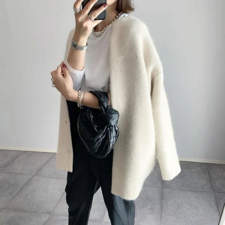 Sophisticated women's long sleeve layering cardigan. Elegant open-front knitwear for cozy stylish fashion.