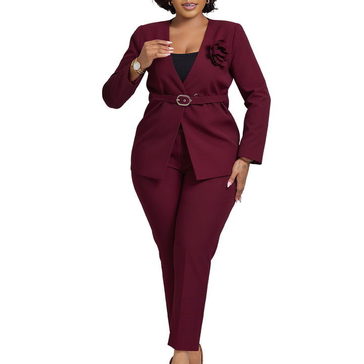 Chic women's ensemble: elegant blazer, tailored pants, and belt with floral design, for stylish women.