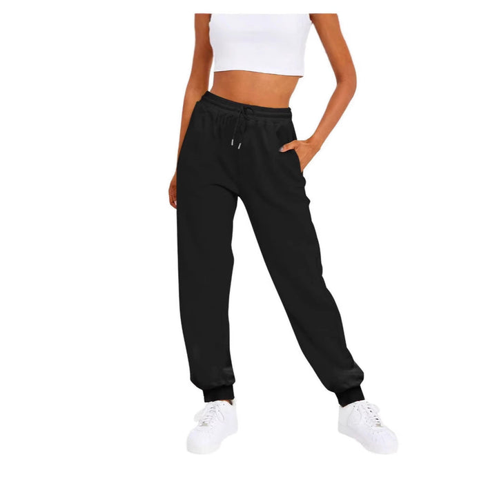 Women's comfortable jogging pants with elastic waistband & side pockets, ideal for lounge & activewear.