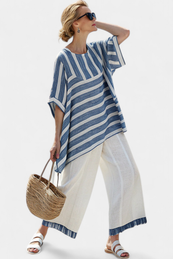 Chic women's blue striped summer outfit, a comfortable two-piece top and pants set ideal for vacation and casual wear.