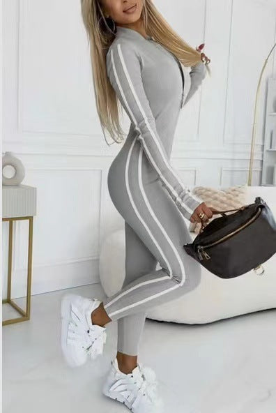 Elegant women's long sleeve striped bodysuit, athletic design for a sleek, modern look.