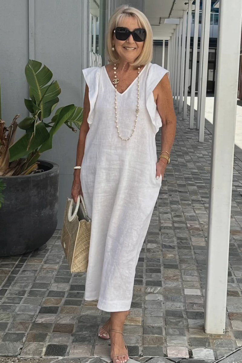 White elegant V-neck sleeveless women's dress, a chic flowy summer maxi for comfortable casual or vacation wear.