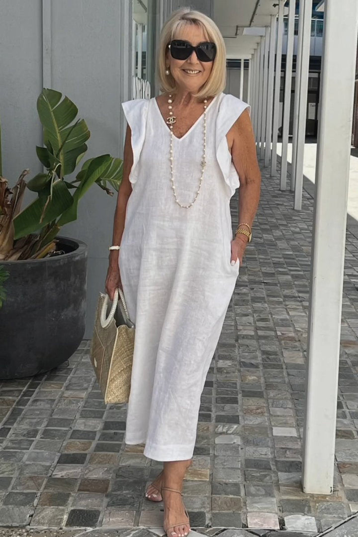 White elegant V-neck sleeveless women's dress, a chic flowy summer maxi for comfortable casual or vacation wear.