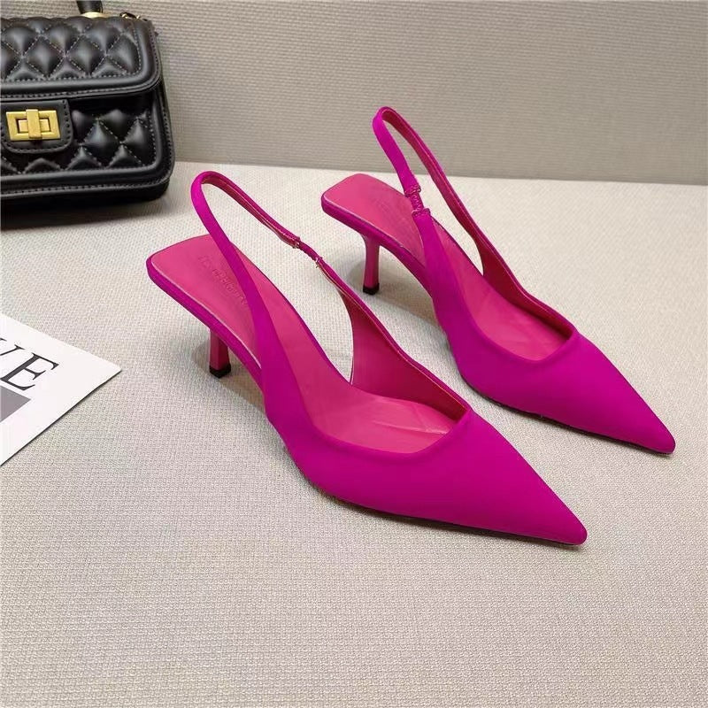 Chic black low-heel slingback pumps for women, with a modern pointed-toe design.