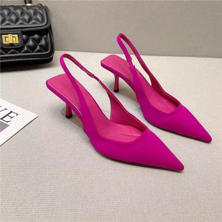 Chic black low-heel slingback pumps for women, with a modern pointed-toe design.