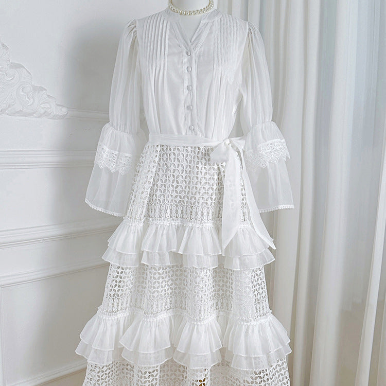 Women's bright white crocheted knit cardigan with ruffles, long sleeve, and v-neck design.