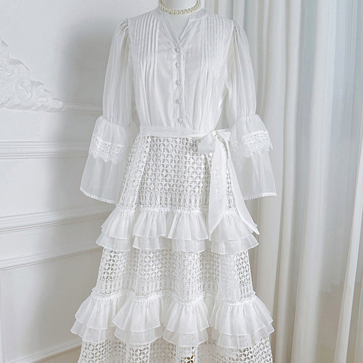 Women's bright white crocheted knit cardigan with ruffles, long sleeve, and v-neck design.