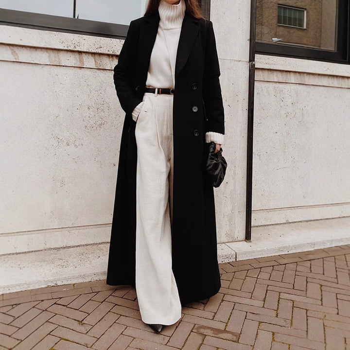 Women's elegant double-breasted coat with deep pockets, perfect for fall and winter fashion.
