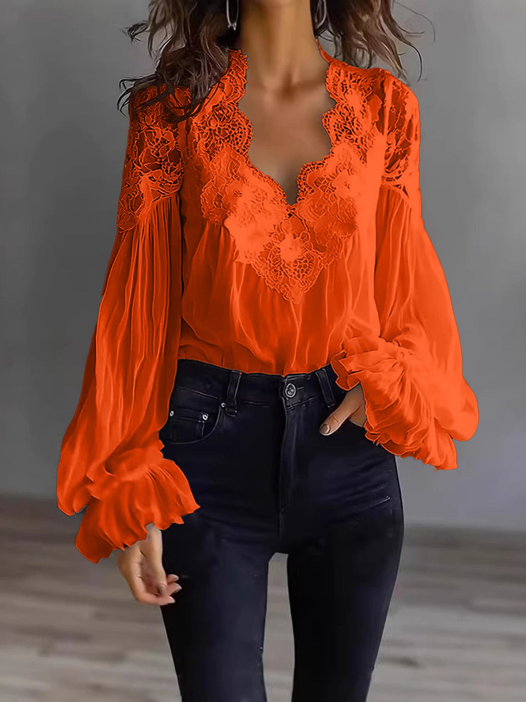 Sophisticated women's lace top with a flowing silhouette and charming ruffle sleeve accents for summer.