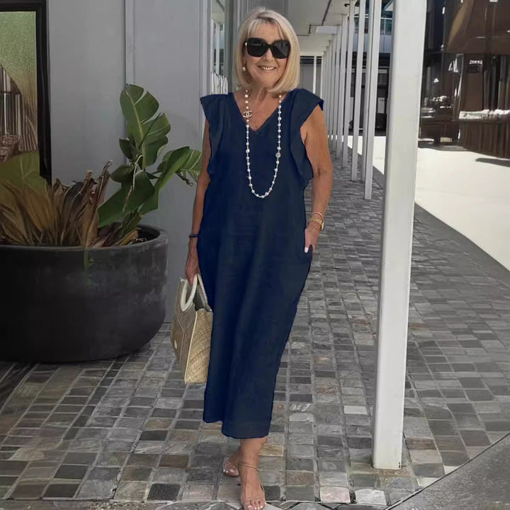 Apricot V-neck sleeveless maxi dress for women, offering elegant comfort and a flowy summer style.