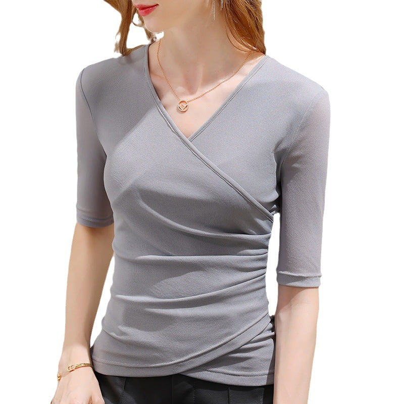 Professional women's V-neck wrap top. Half sleeves & sophisticated draping, ideal for office or elegant casual.