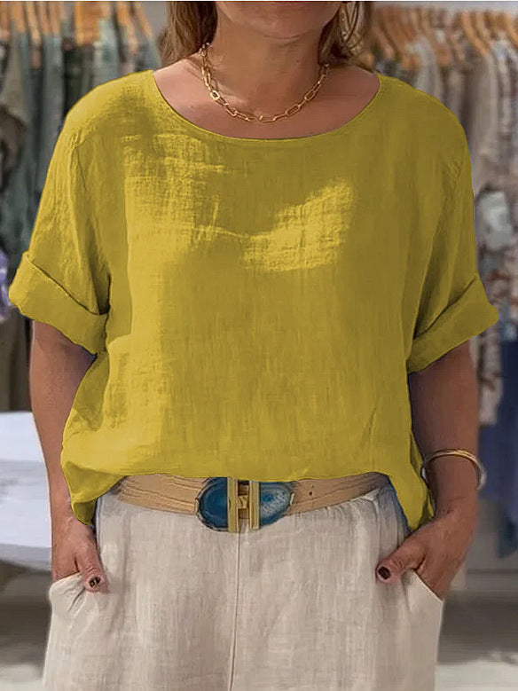 White women's relaxed fit top, rolled sleeves, lightweight for comfortable summer and spring wear.