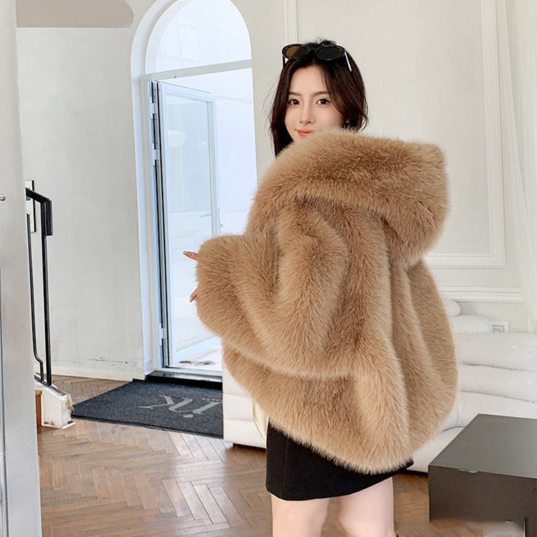 Soft faux fur hooded long sleeve coat for women, providing warmth & a chic look in cold weather.