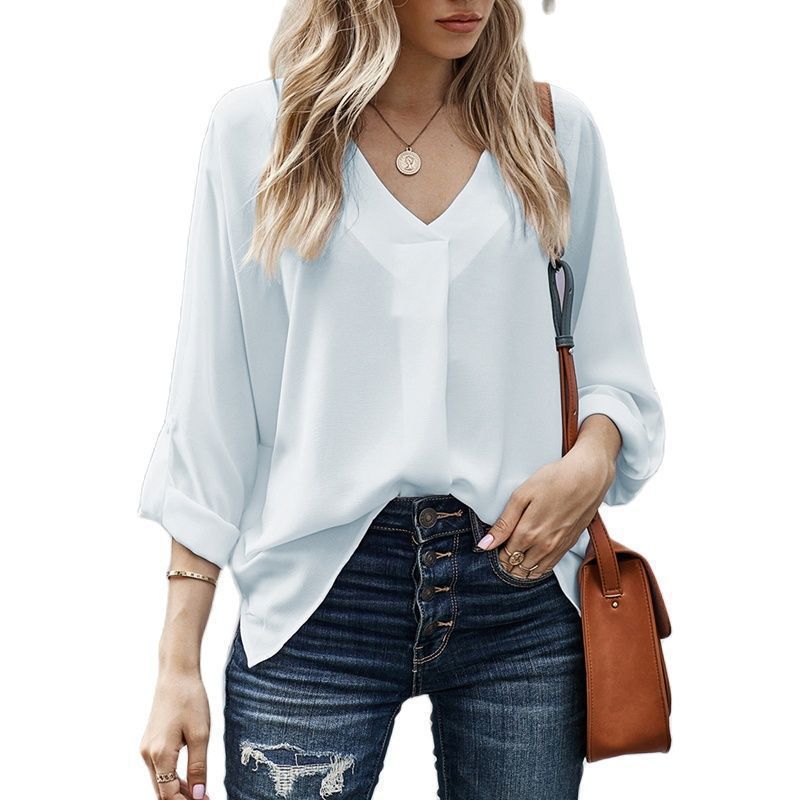 Relaxed fit women's V-neck casual shirt with short sleeves, perfect for everyday elegance & comfort.