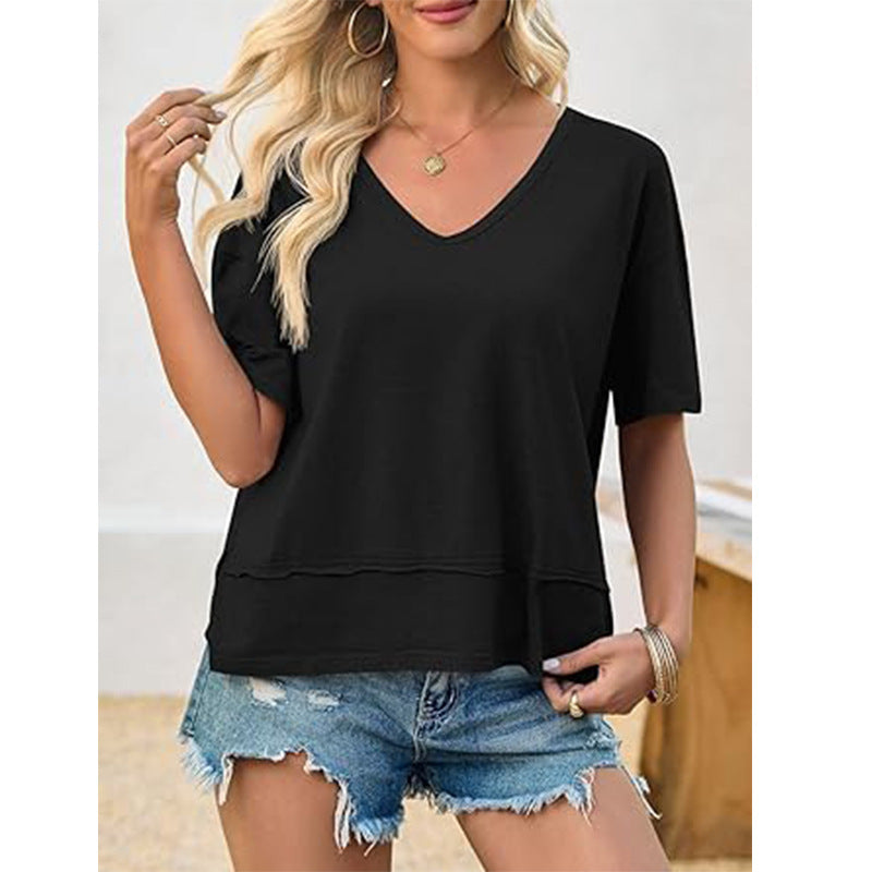 Model showcasing a relaxed women's V-neck t-shirt, emphasizing its loose fit and comfortable everyday casual style.