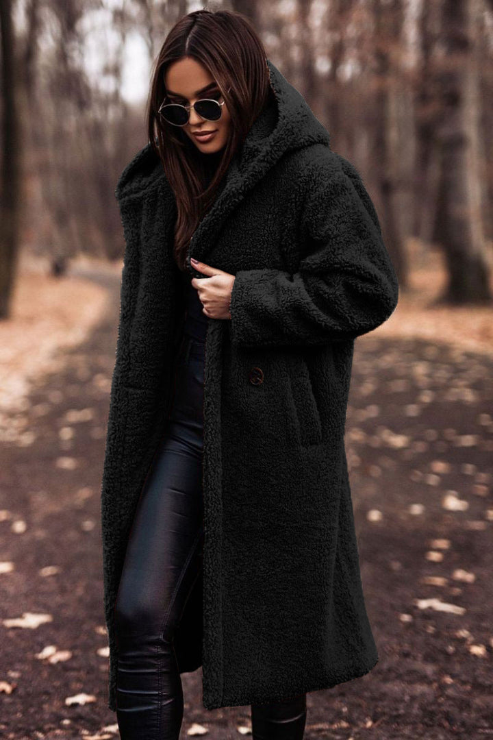 Cozy & stylish women's hooded longline plush coat, ideal casual winter outerwear.