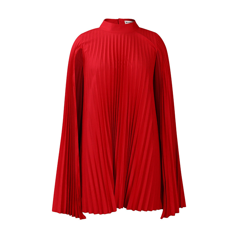 Formal black pleated cape dress for women. High collar, long sleeves. Elegant evening gown, wedding guest attire.