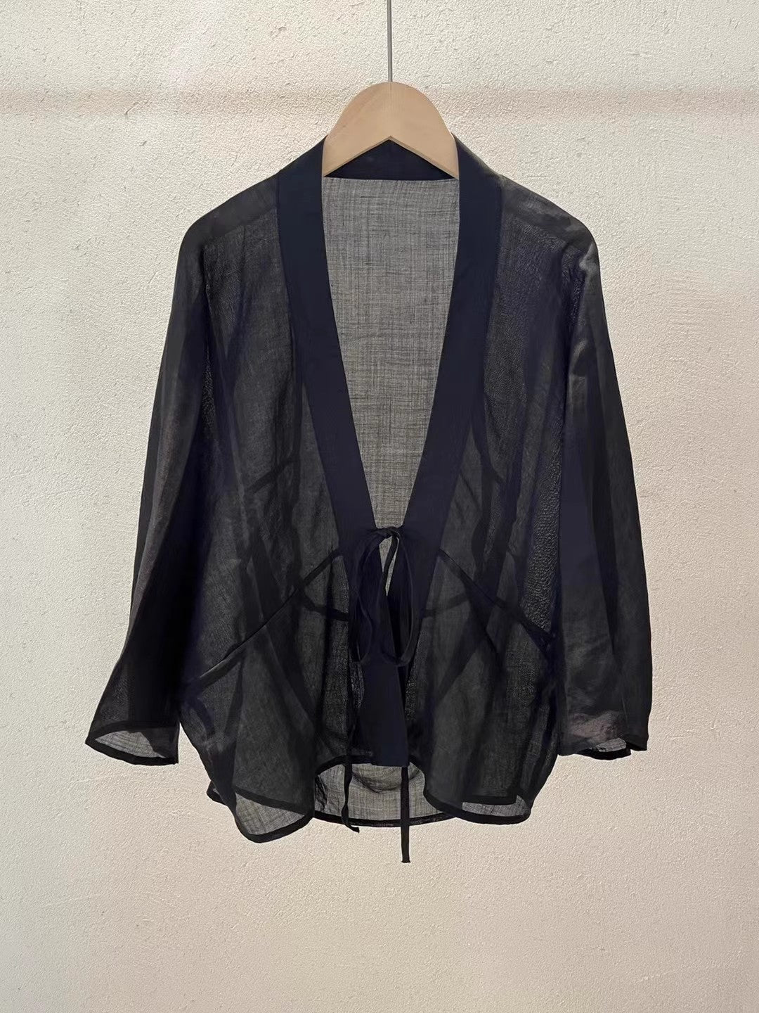 Women's elegant sheer wrap jacket, providing effortless style and a perfect lightweight addition to any outfit.